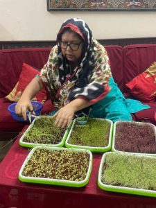 A Bangladeshi Women is Growing Microgreens at home